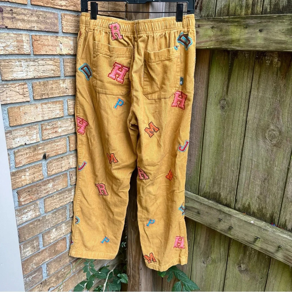 Urban Outfitters Mustard Corduroy Pants with Colorful Letters - Picture 3 of 3